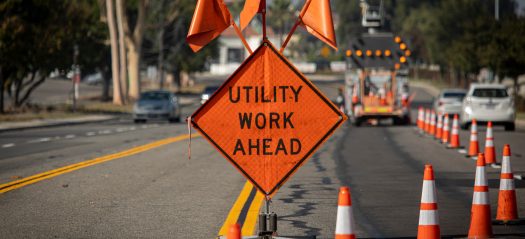 Traffic,Sign,With,Flags,Reading,Utilitary,Work,Ahead,With,Traffic Traffic,Sign,With,Flags,Reading,Utilitary,Work,Ahead,With,Traffic